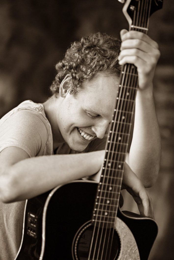 Zach with a guitar