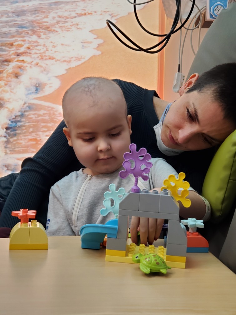 Era in the hospital playing with toys