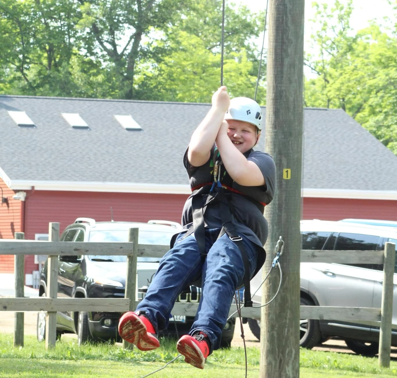 Fitz going on the zipline at Camp Norden