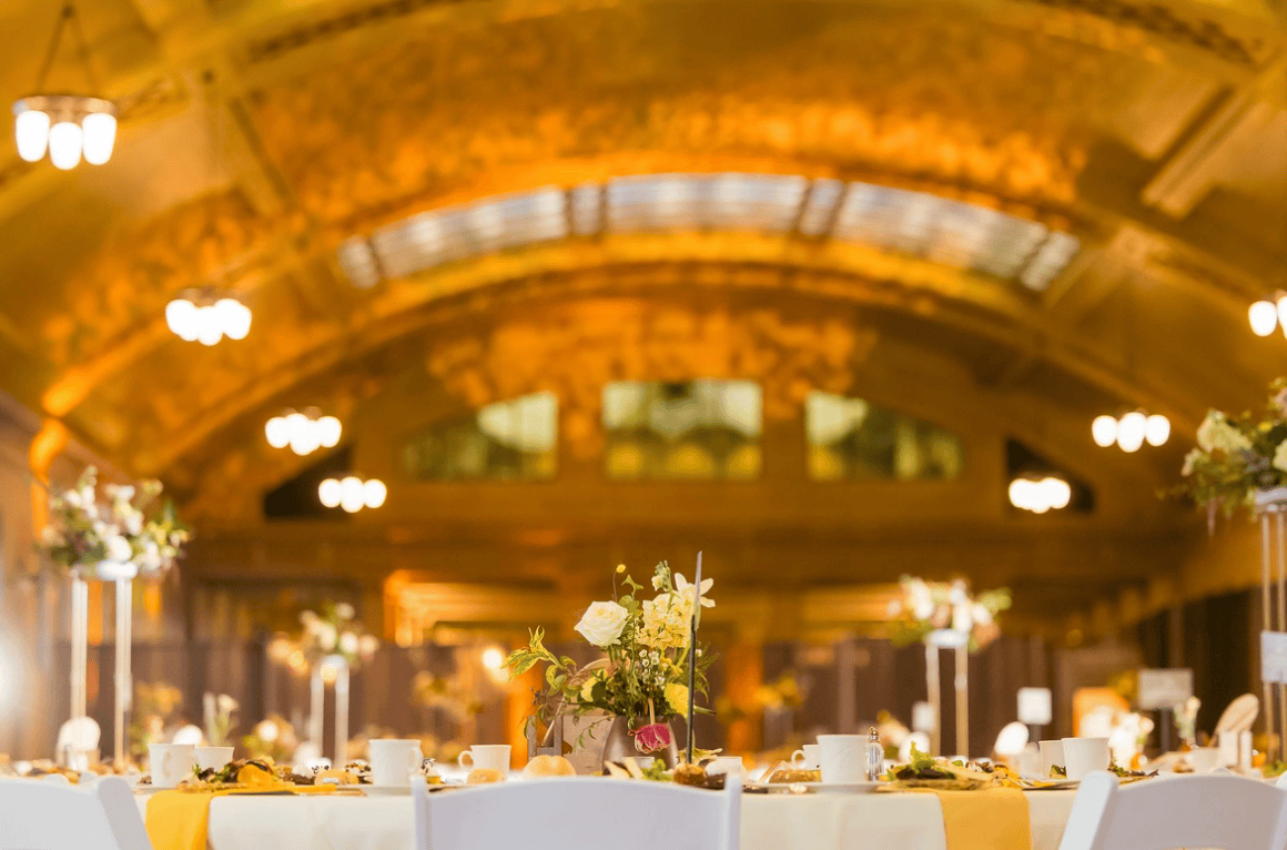 A bright, warm lit formal gala venue