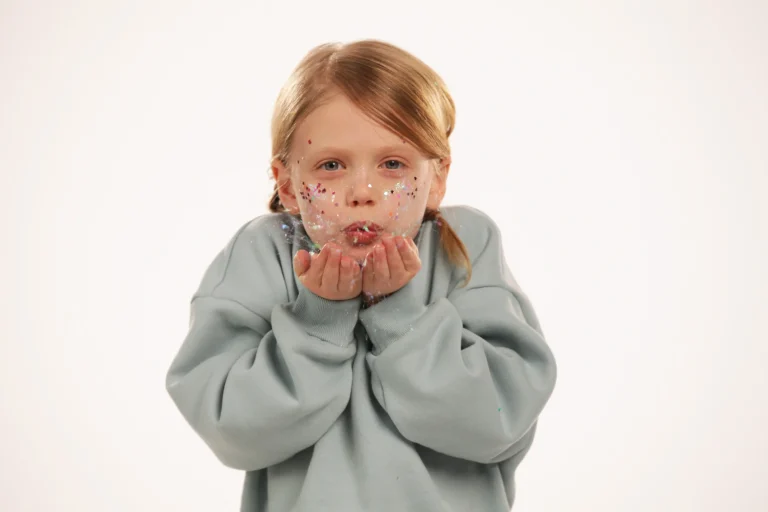 Ella blowing glitter