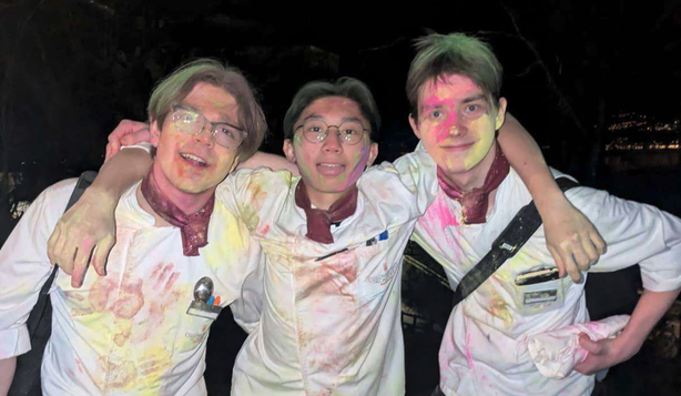 Cole and his chef friends covered in colored powder