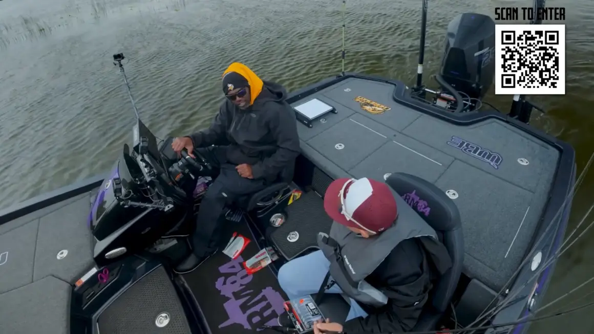 Randy Moss and Isaac, a cancer survivor, on Randy's custom fishing boat